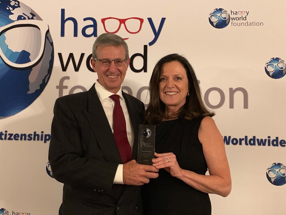 Avant founders David and Sheila Bong smile while holding the inaugural Global Citizen Award he received from The Happy World Foundation Inc.